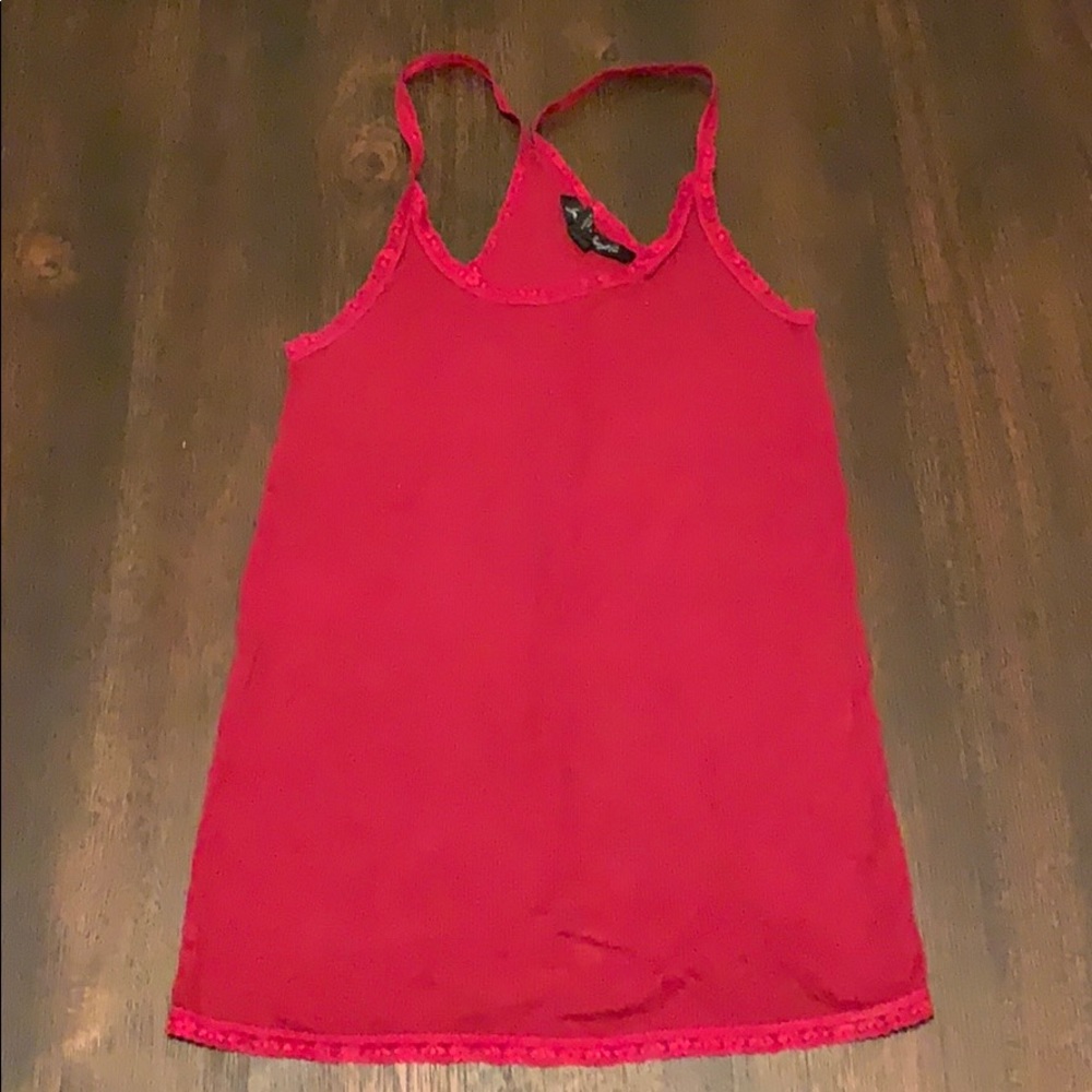 Jimmy’z red tank top